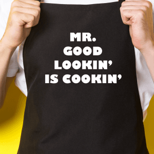 Zwart keukenschort / BBQ-schort met tekst | Mr. Good Lookin is Cookin